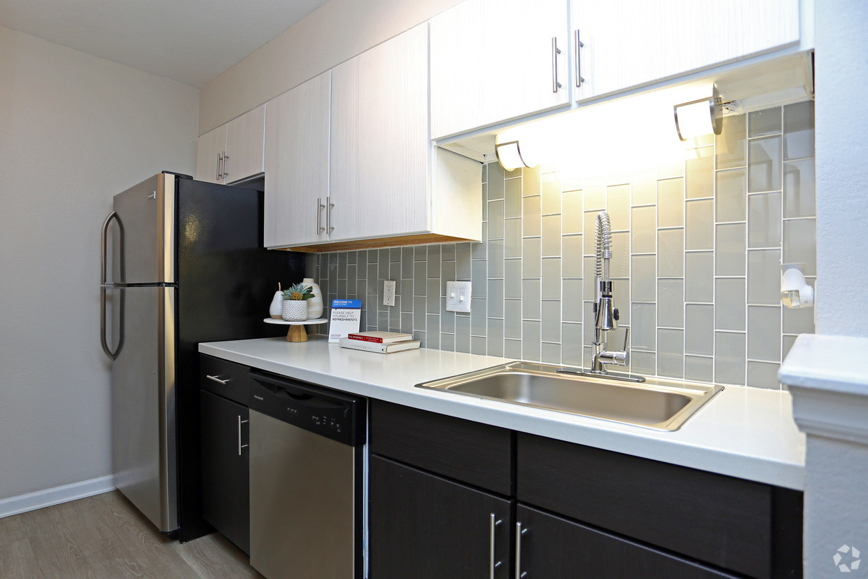 Kitchen with white countertops and stainless steel appliances