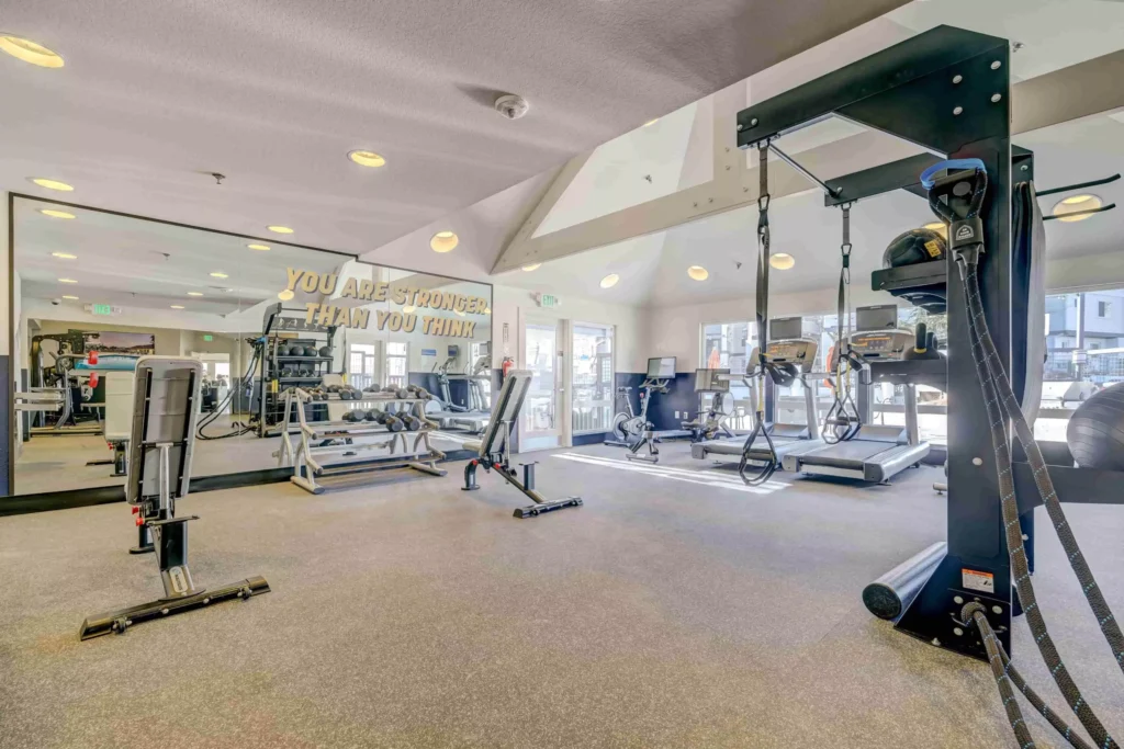 Fitness center with strength training equipment at Village Creek apartments in Westminster, CO